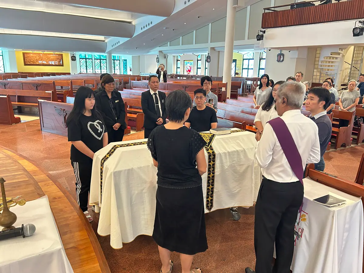 Pallbearers carrying a casket at a Funeral in Singapore