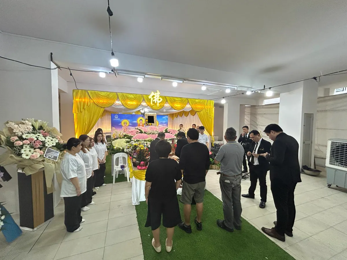 Guests paying their respects at a Buddhist wake in Singapore