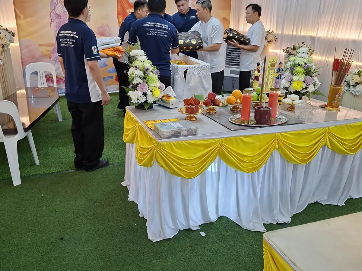 Endearing Funeral Services staff tending the altar and offerings during a Buddhist wake