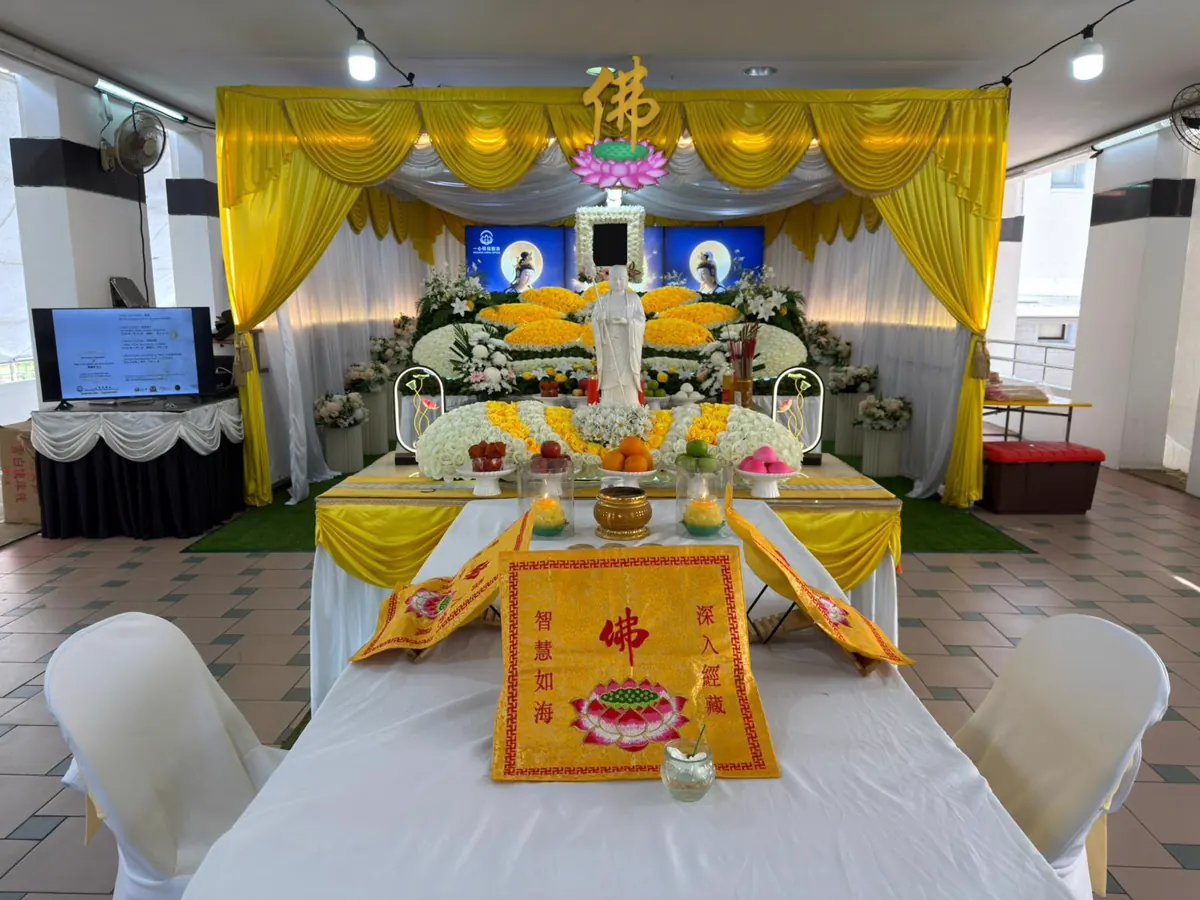 Tentage and altar set up for a Buddhist wake, sheltered against rain
