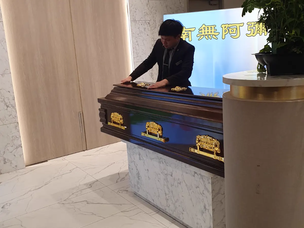 Family paying final respects before cremation at Mandai