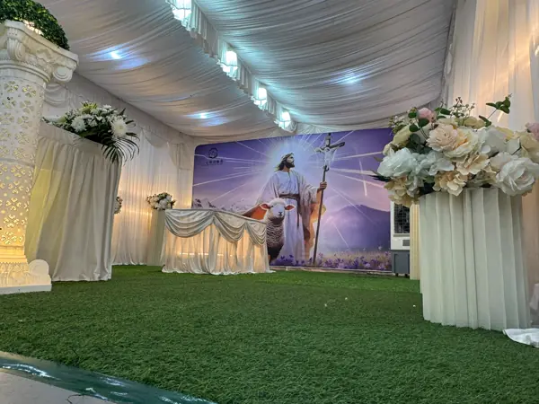 Catholic wake setup with cross and altar in Singapore