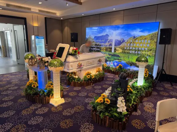 Catholic funeral altar with flowers and portrait in Singapore