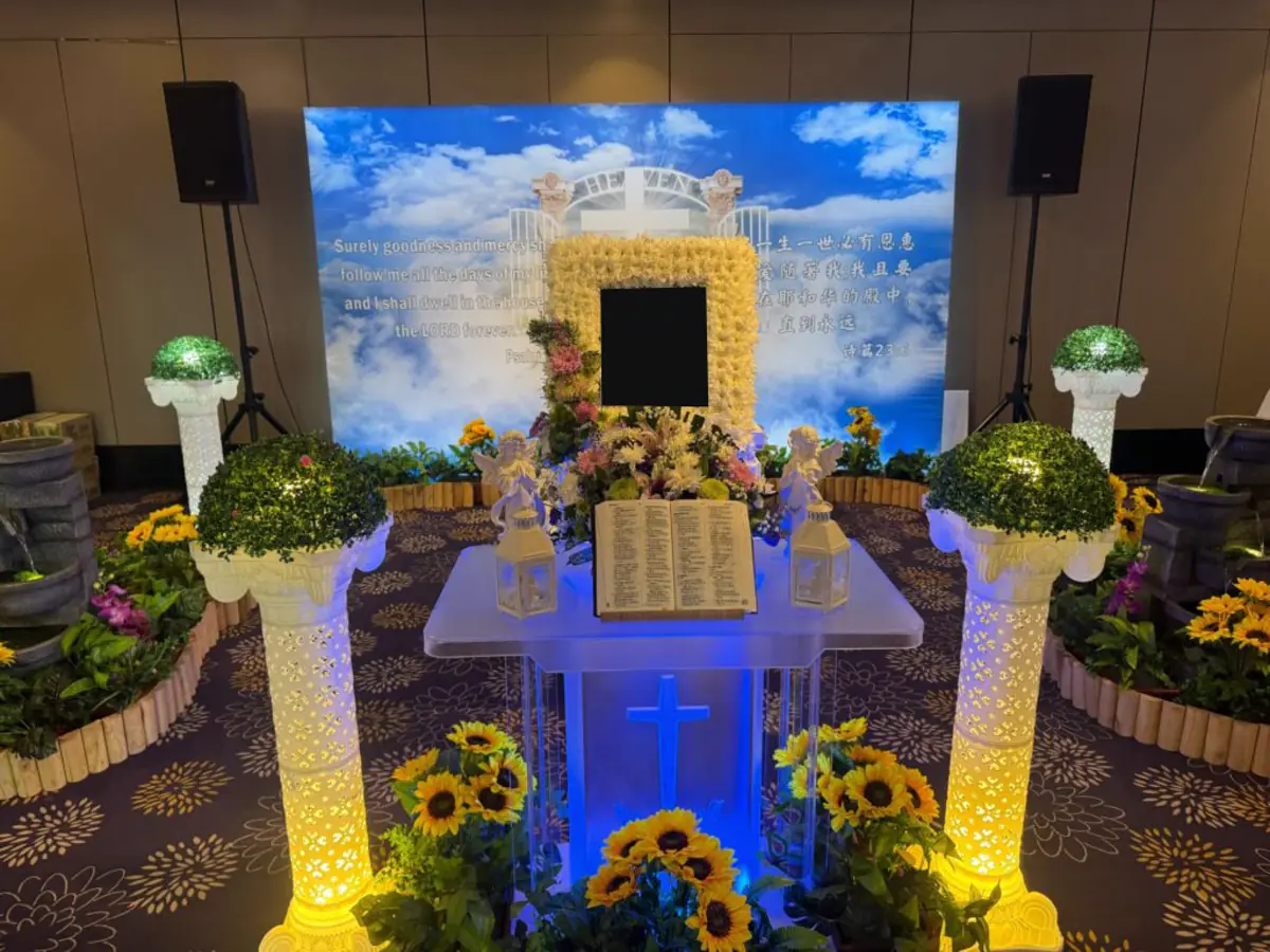 A Catholic wake service in Singapore with hymn lyrics on screen
