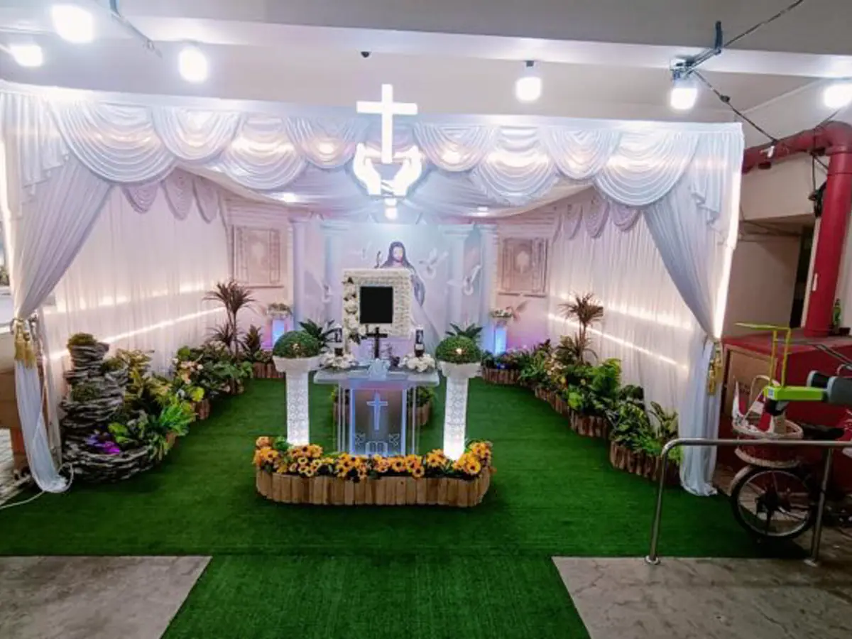 A void deck wake in Singapore, set up for a Catholic family