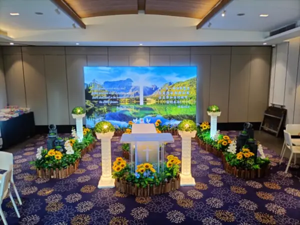 Christian funeral setup with floral arrangements in Singapore