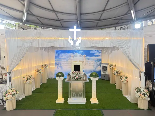 Christian wake hall with cross and drapery in Singapore