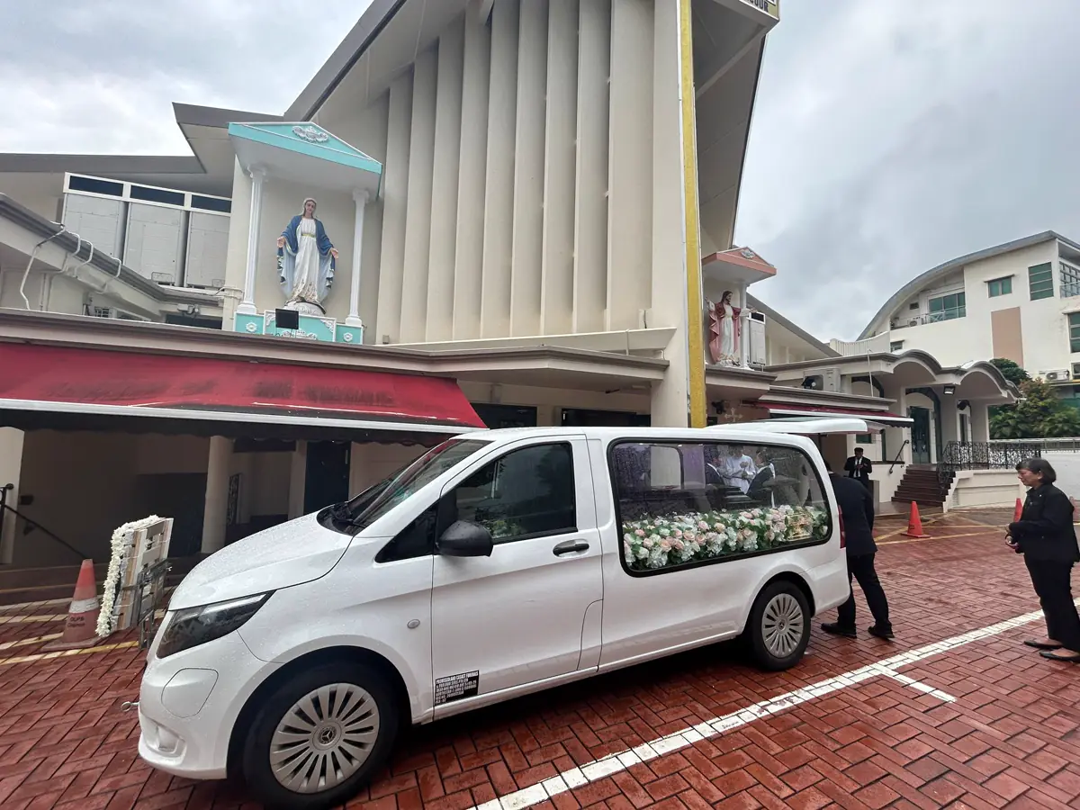 A hearse waiting outside a church in Singapore after a funeral service