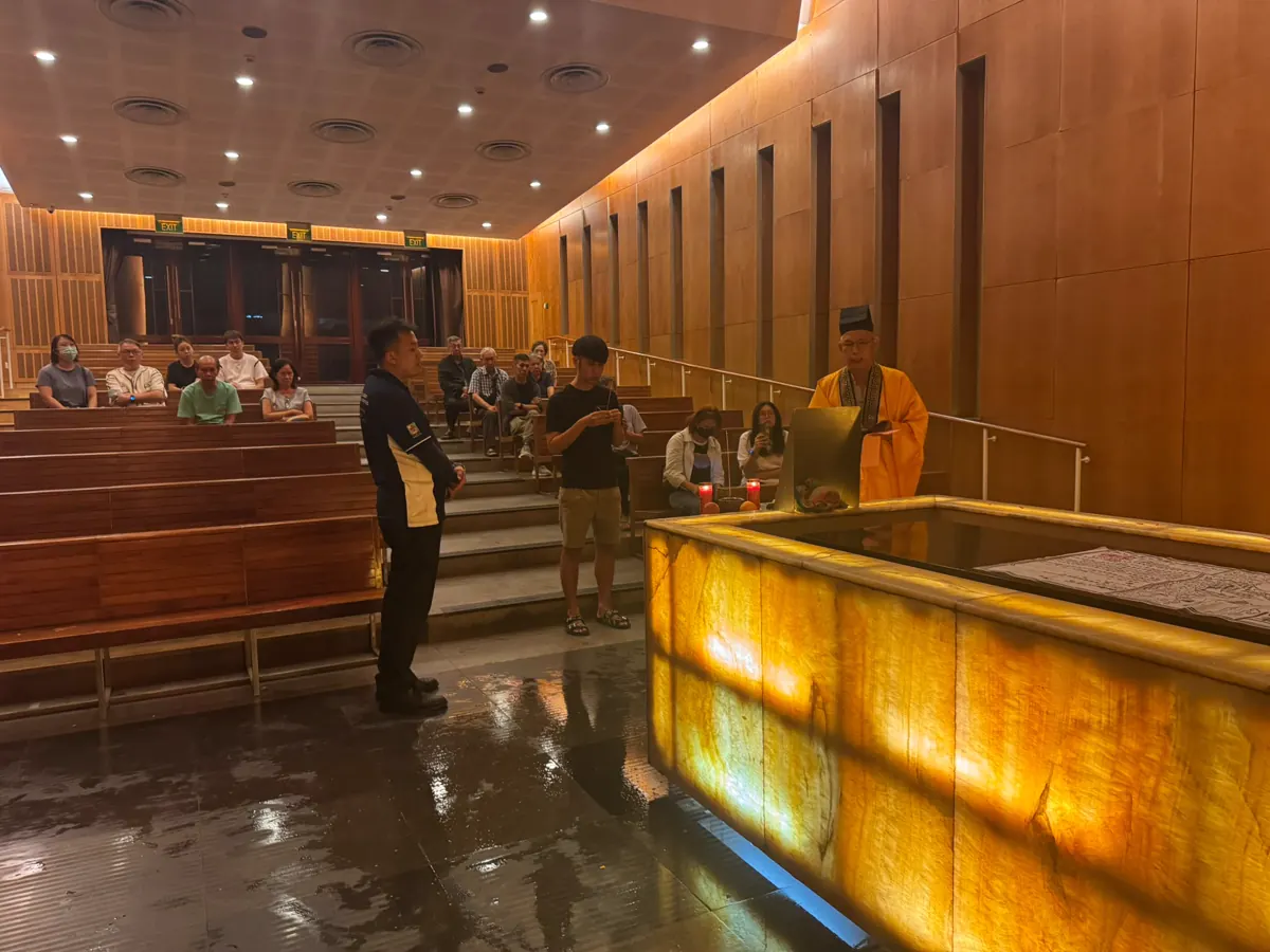 Family at the committal in the crematorium hall