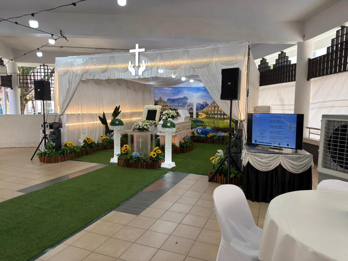 A funeral altar and hall set up before the family arrives