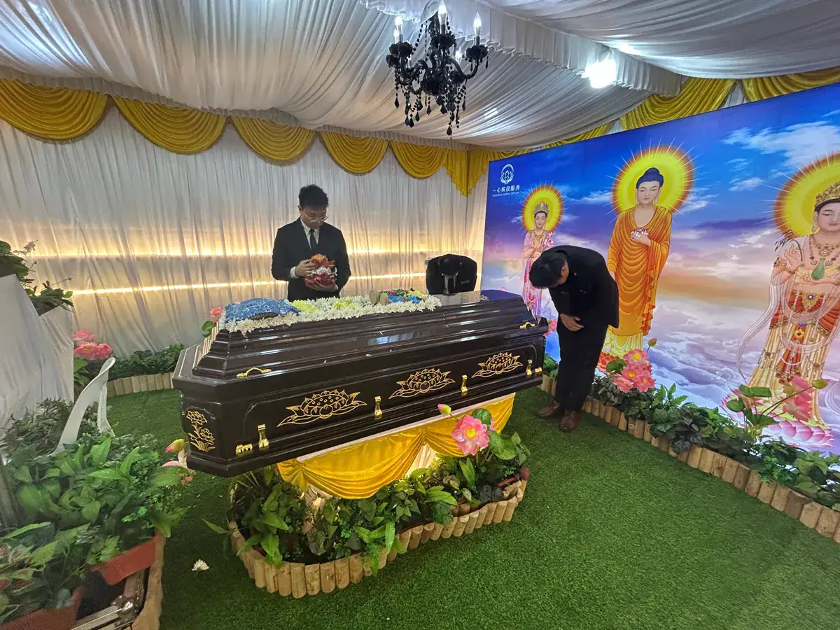 Buddhist funeral wake with an altar and casket in Singapore