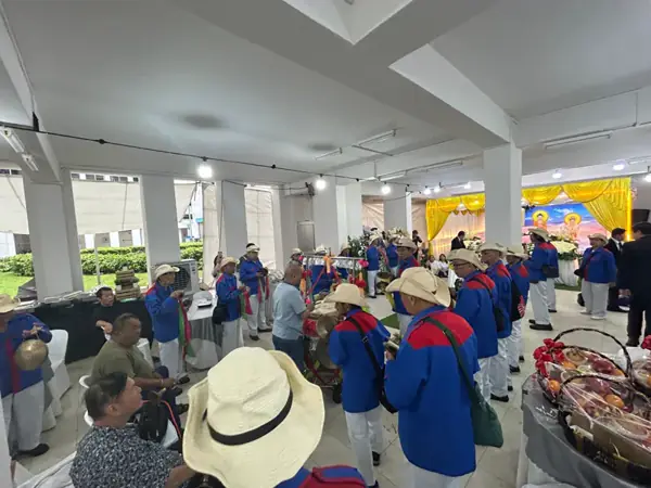 Guests at a Buddhist wake at an HDB void deck