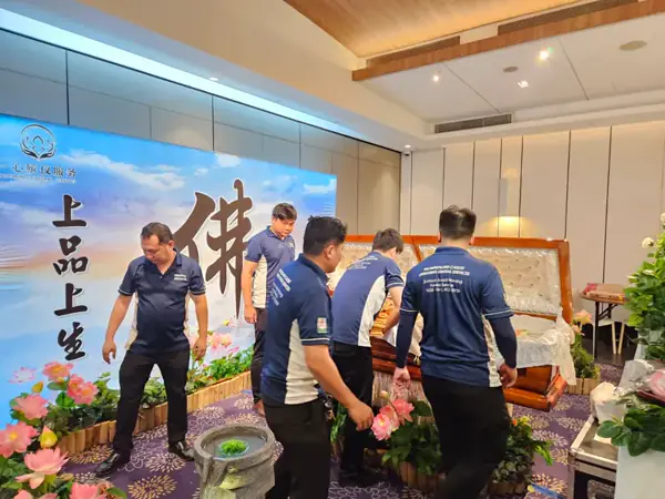 Family paying respects at a Buddhist funeral