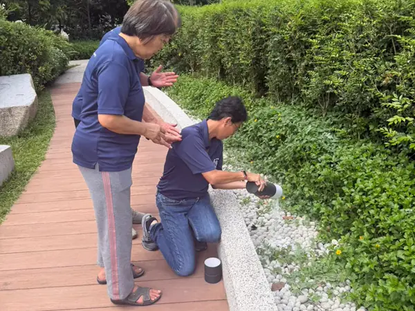 Family scattering ashes at the Garden of Peace