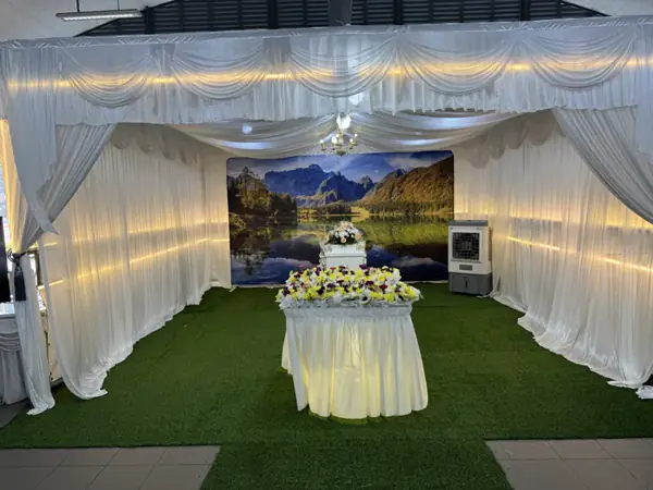 A simple altar with a photograph at a freethinker wake