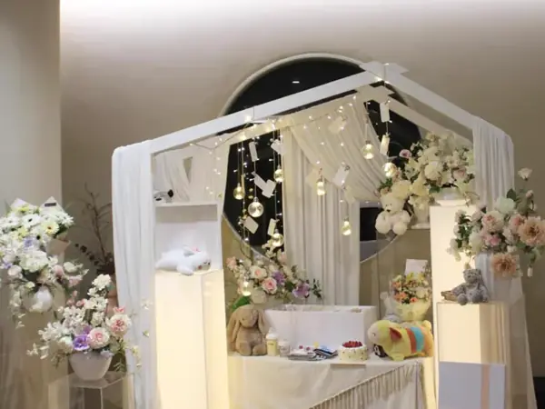 A small floral archway prepared for a child's farewell