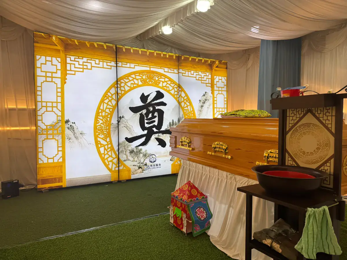Taoist funeral wake with a traditional altar in Singapore