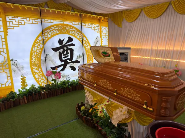 Taoist wake with cross and sky backdrop in Singapore