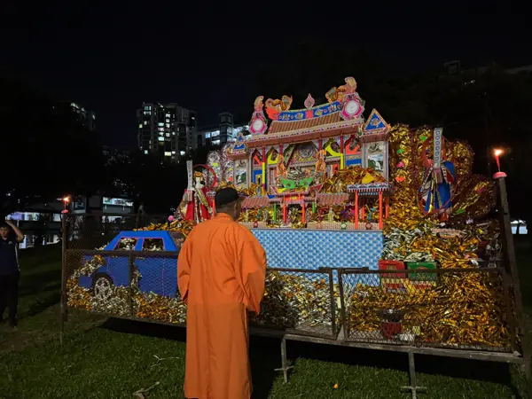 Taoist funeral altar with flowers and portrait in Singapore